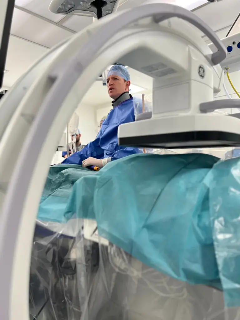 Cardiologist performing a catheter ablation procedure in a cardiac catheter lab
