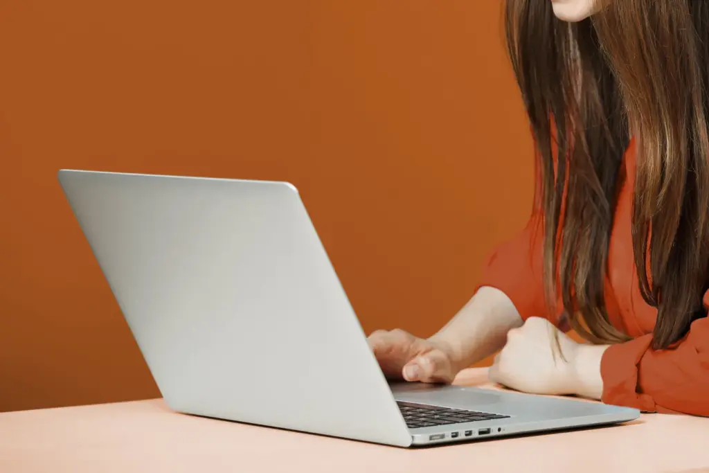 Person using a laptop to book an appointment online